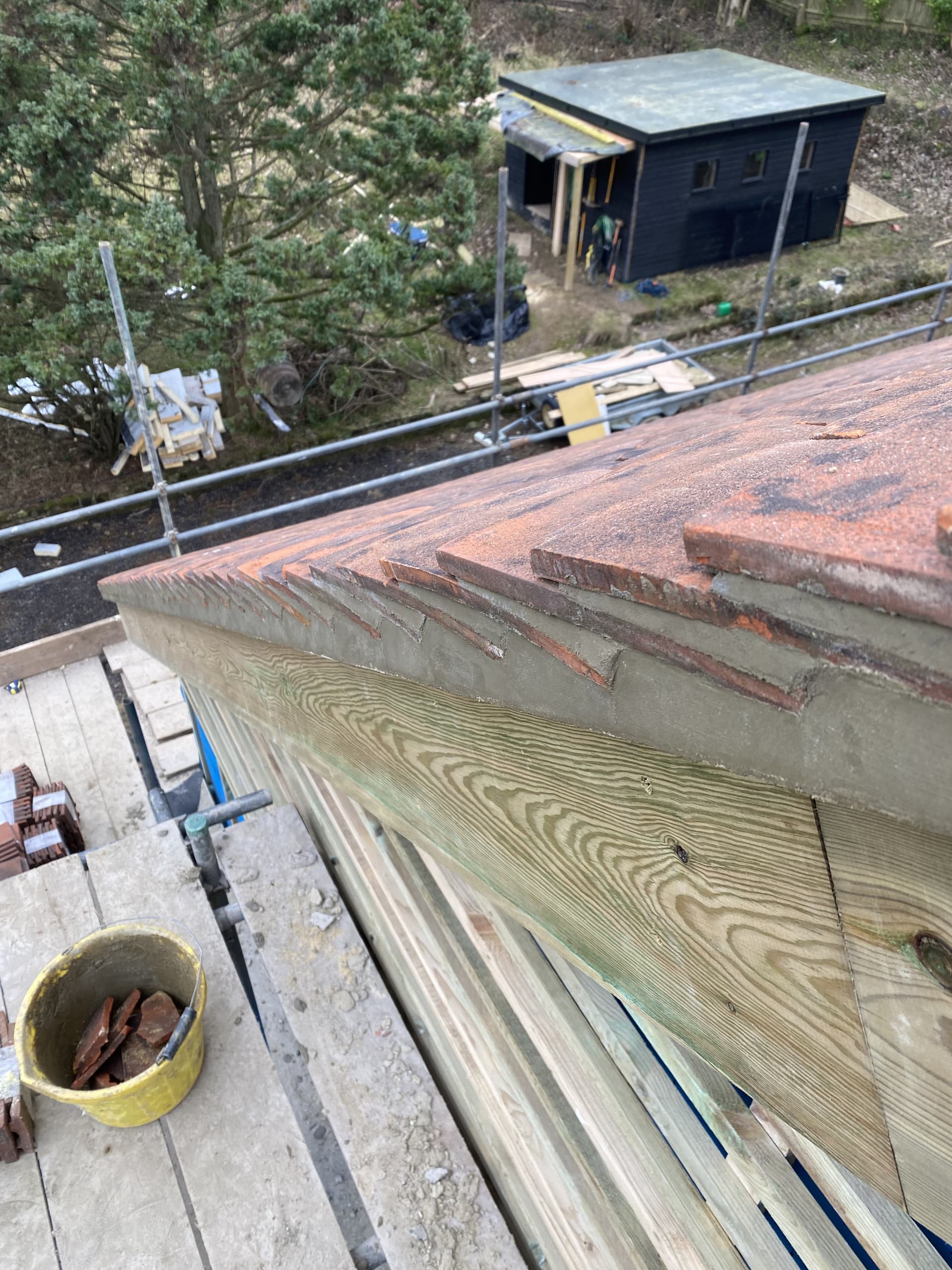 Parapet wall and timber fascia with scaffolding