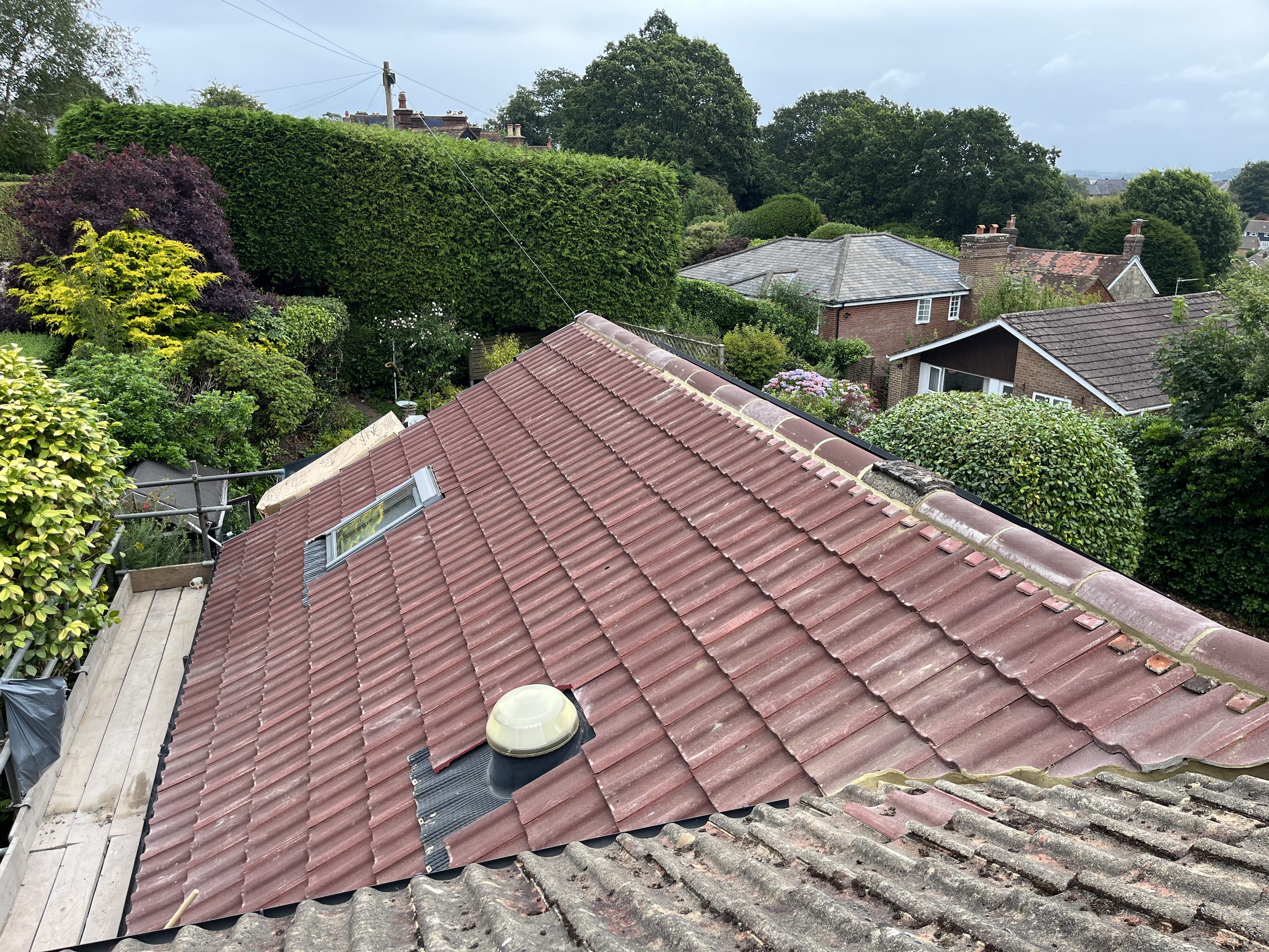 New concrete tile roof with skylight and vent
